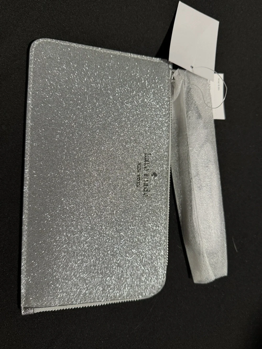 Kate Spade’s Silver Glitter Zip Wristlet